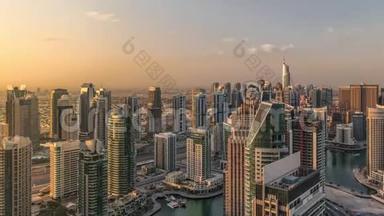 迪拜码头摩天大楼和朱美拉湖塔日出观从最高空中时间在阿拉伯联合酋长国